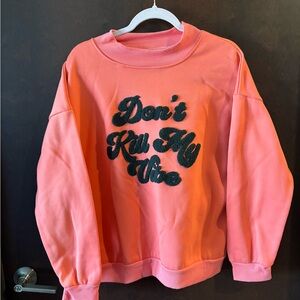 Coral Sweatshirt with Black Text